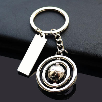 Football rotating keychain with label tag